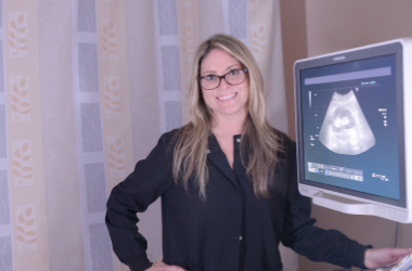 Vanessa Rokjer standing next to ultrasonogram equipment